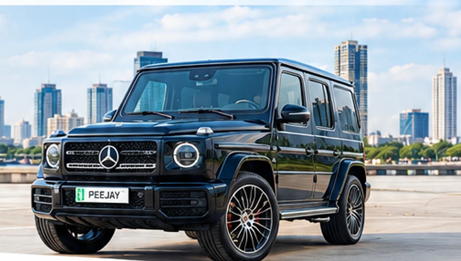 A black Mercedes-Benz G-Class on the Lagos waterfront with the Victoria Island skyline behind